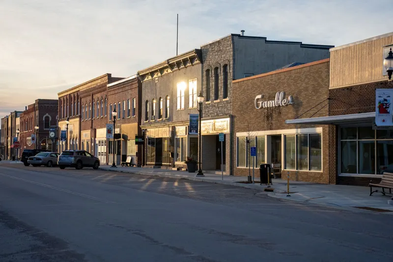 Downtown main street with brick storefronts at golden hour