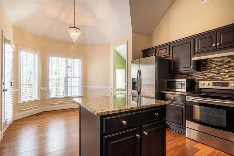 Bright kitchen with island seating and natural light