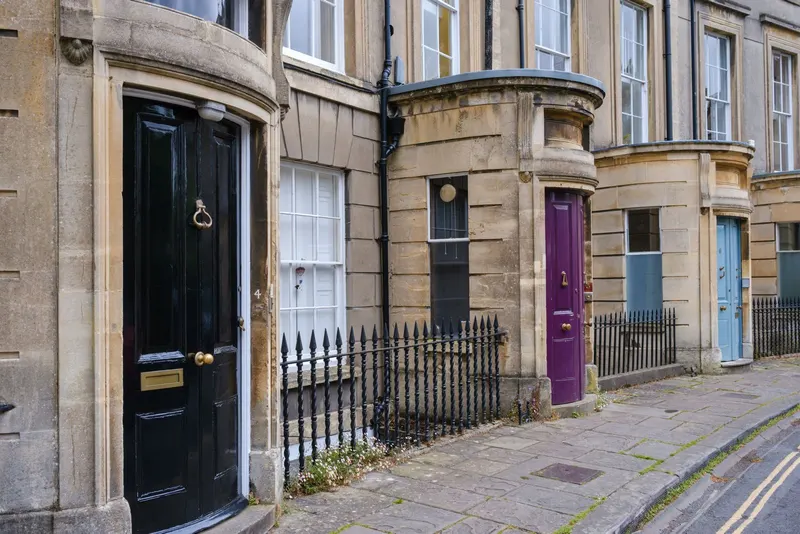 A row of different front doors on one street