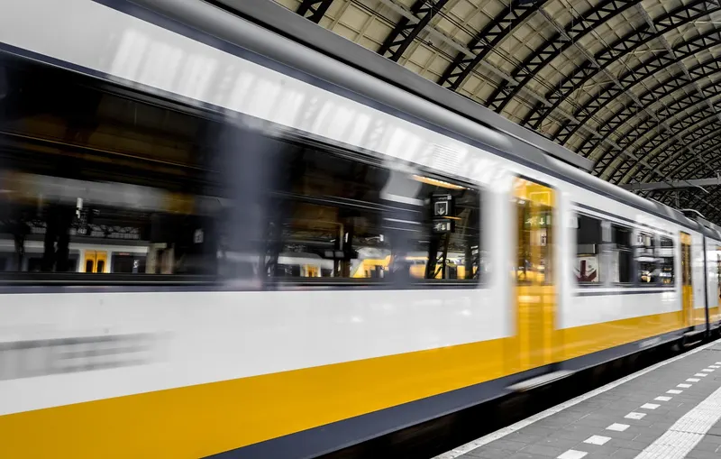 Commuter train arriving at a station platform